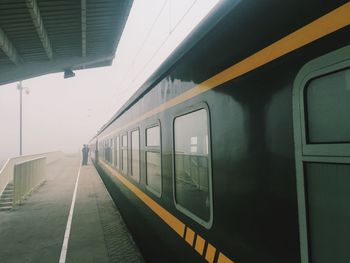 Diminishing view of train stopping at station platform