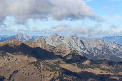 Scenic view of mountains against cloudy sky