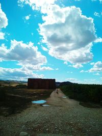 View of road against cloudy sky