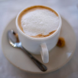 Close-up of cappuccino on table