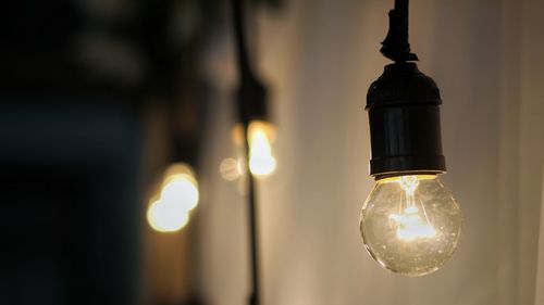 Close-up of illuminated light bulb