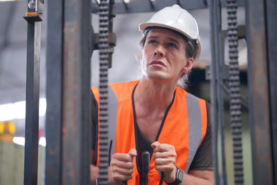 Portrait of young man standing in gym