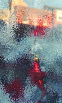 Close-up of wet window during rainy season