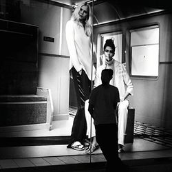 Man and woman standing in corridor
