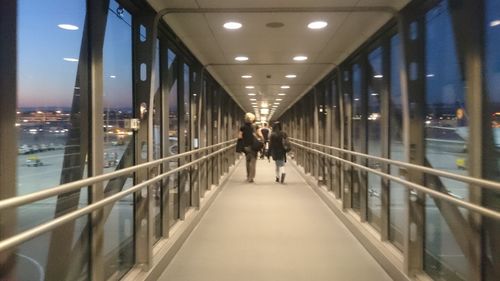 Man on illuminated bridge in city