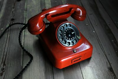 High angle view of telephone on table