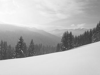 Scenic view of mountains against sky during winter