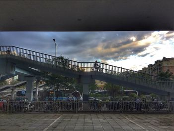 Bridge against sky in city