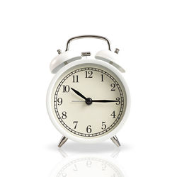 Close-up of clock over white background