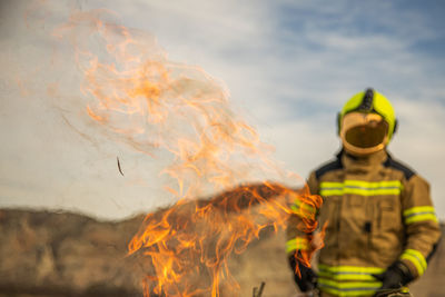 Midsection of man with fire crackers