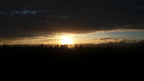 Silhouette landscape against sky during sunset