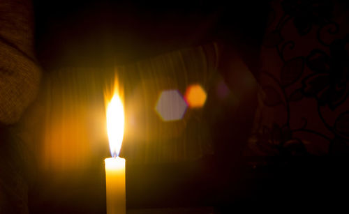 Close-up of illuminated candle