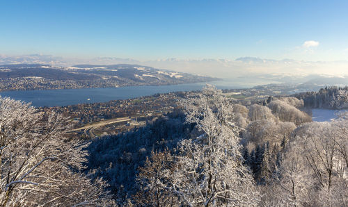 Aerial view of snow covered mountain against sky