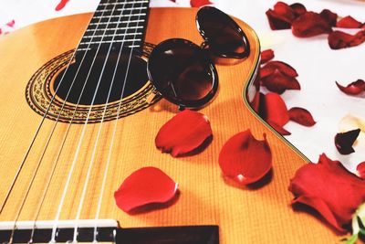 Close-up of guitar on table