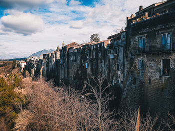 View of old building against cloudy sky