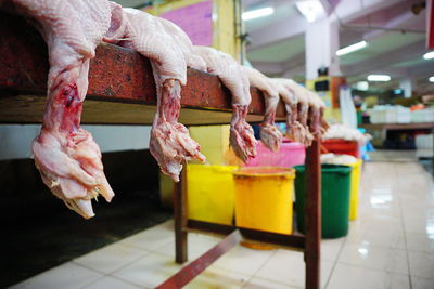 Close-up of chicken meat on table in factory