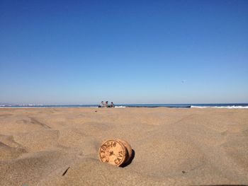 Scenic view of beach against clear sky