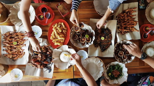 Directly above shot of people having food on table