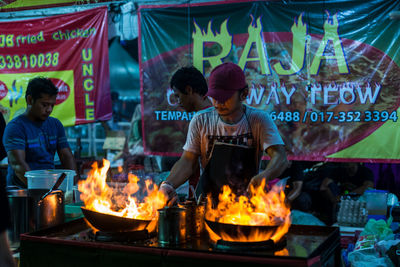 People at market stall