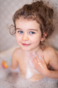 Portrait of cute girl in bathroom