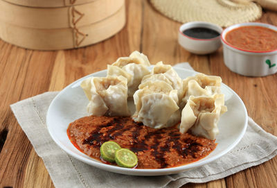 Siomay ikan bandung, fish dumpling served with spicy peanut sauce and sweet soy sauce