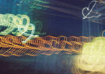 Low angle view of light trails at night