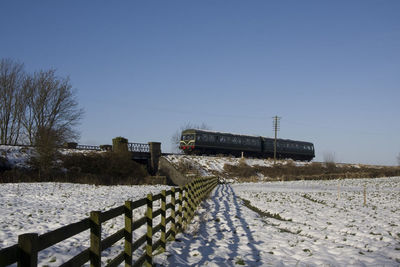 View of road against clear blue sky