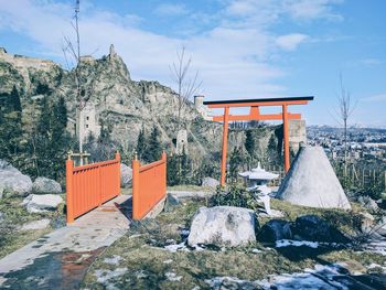 Built structure on mountain against sky