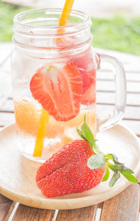 Close-up of drink with strawberries on table