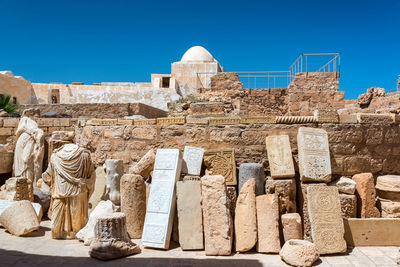 Statue of historic building against clear sky