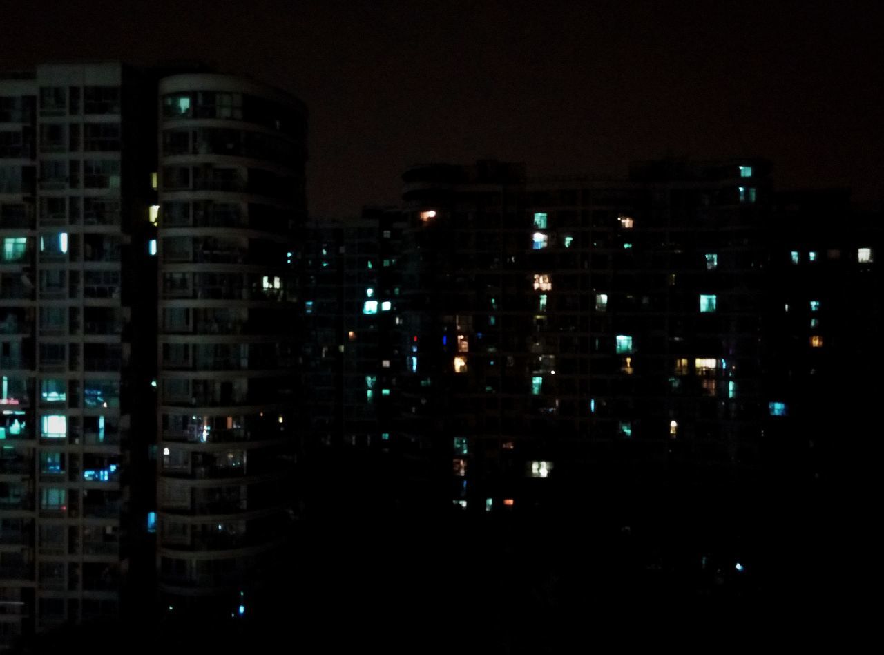 VIEW OF ILLUMINATED BUILDINGS AT NIGHT