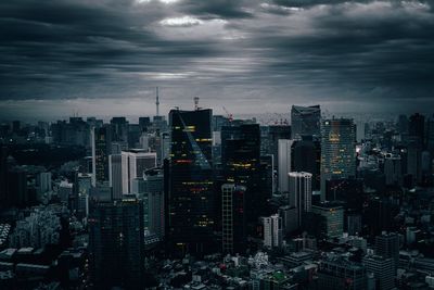 Aerial view of modern buildings in city against sky