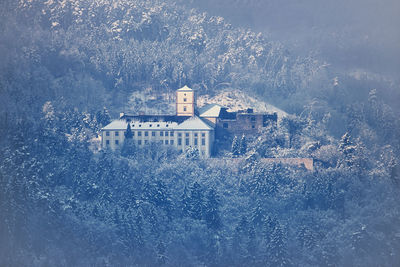 Aerial view of buildings on snow covered land