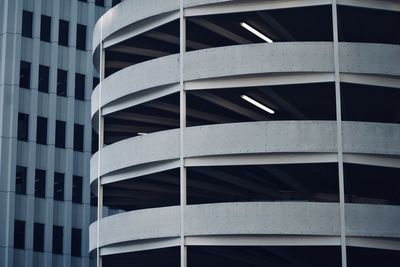 Circular parking garage with a building in the background