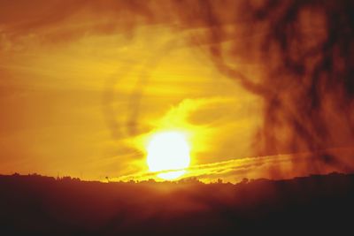 Low angle view of dramatic sky during sunset