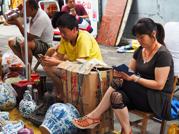 Group of people sitting outdoors