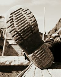 Low section of man on wooden floor