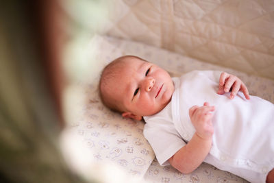 Cute baby sleeping on bed