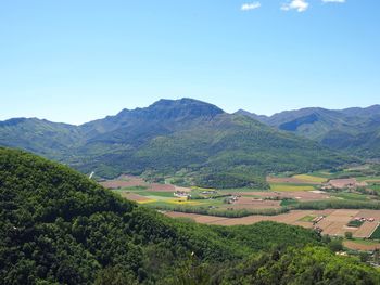 Scenic view of agricultural landscape against sky