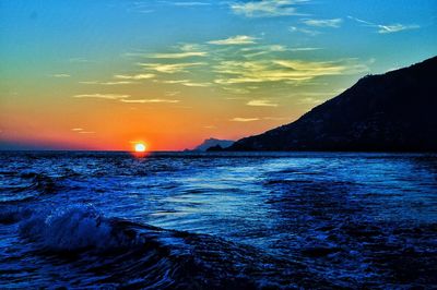 Scenic view of sea against dramatic sky