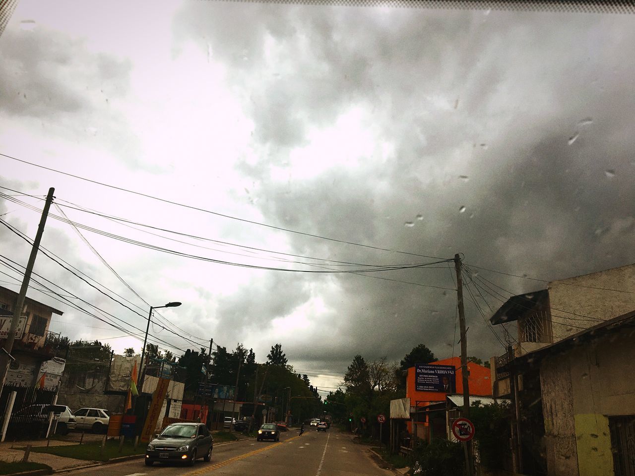 transportation, road, street, sky, cloud - sky, land vehicle, mode of transport, car, cloudy, the way forward, day, cloud, power line, cloudscape, outdoors, diminishing perspective, journey, city life