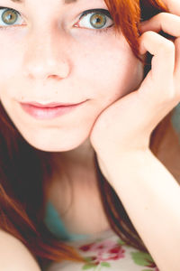 Close-up of young woman with gray eyes