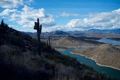 Scenic view of lake against cloudy sky