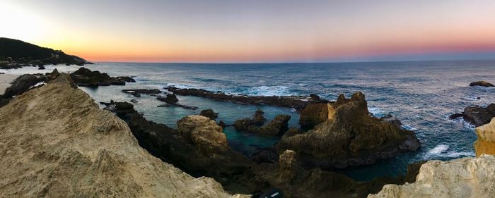 Scenic view of sea against sky during sunset