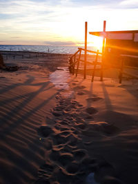 Scenic view of beach against sky during sunset