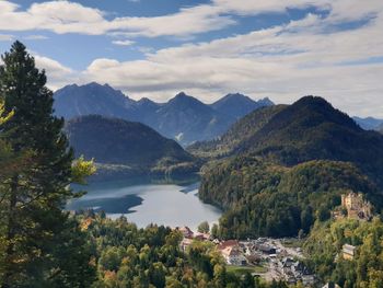 Scenic view of lake and mountains with a castle