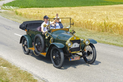People riding motorcycle on road
