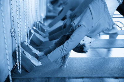 Low section of woman standing on staircase