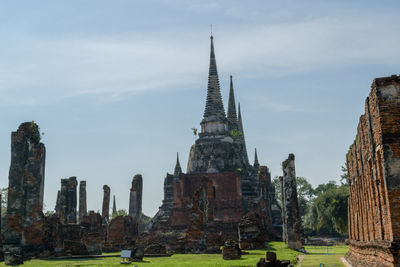 Panoramic view of temple against buildings