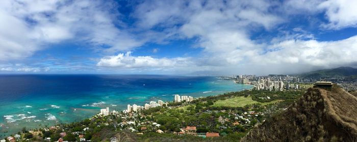 Panoramic view of sea and town against sky